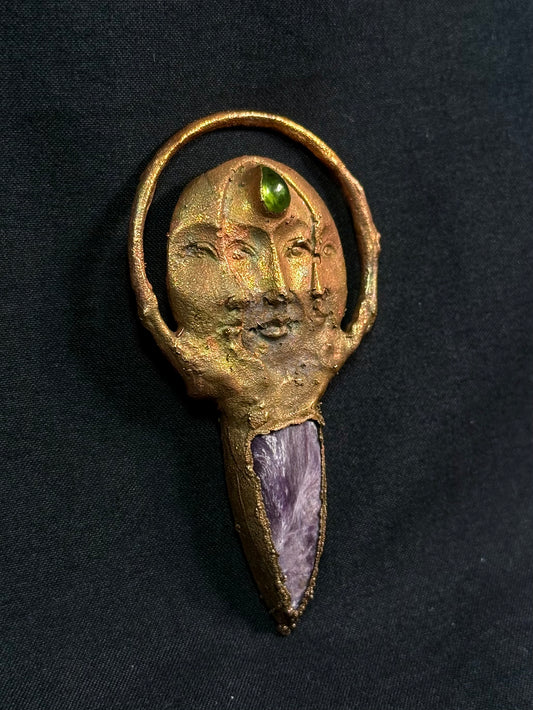 The sun and moon charoite amulet