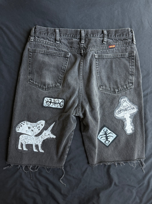 Black and white patch black jean shorts