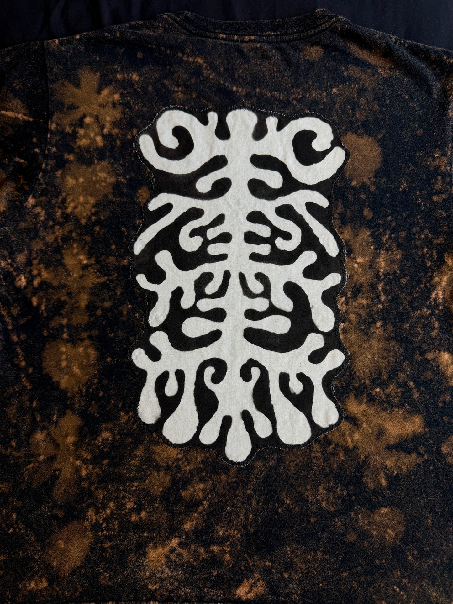 Abstract butterfly + shape bleach dyed t-shirt