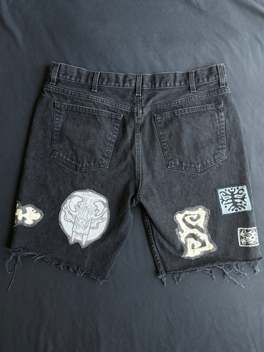 Black and white patch black jean shorts