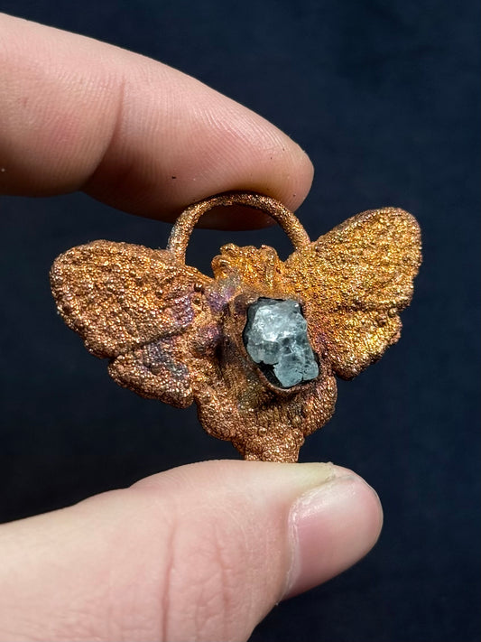 Garnet moth amulet