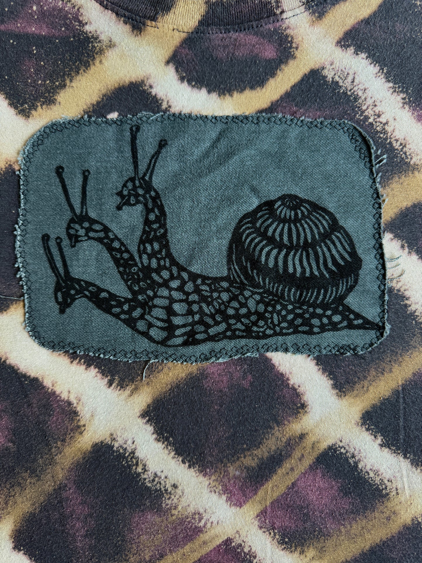 Three headed snail bleach dyed t-shirt