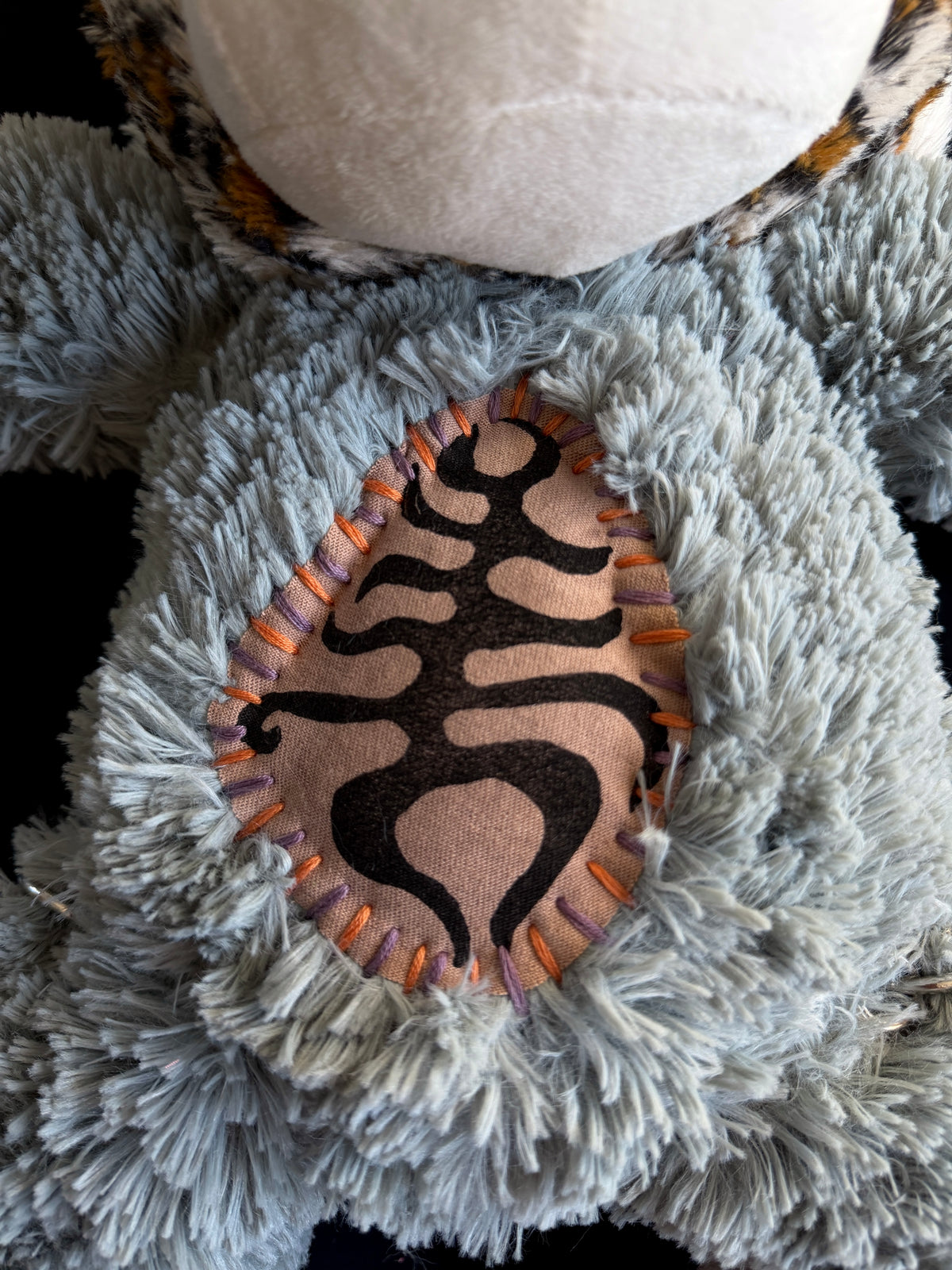 Leopard + sloth hybrid back pack