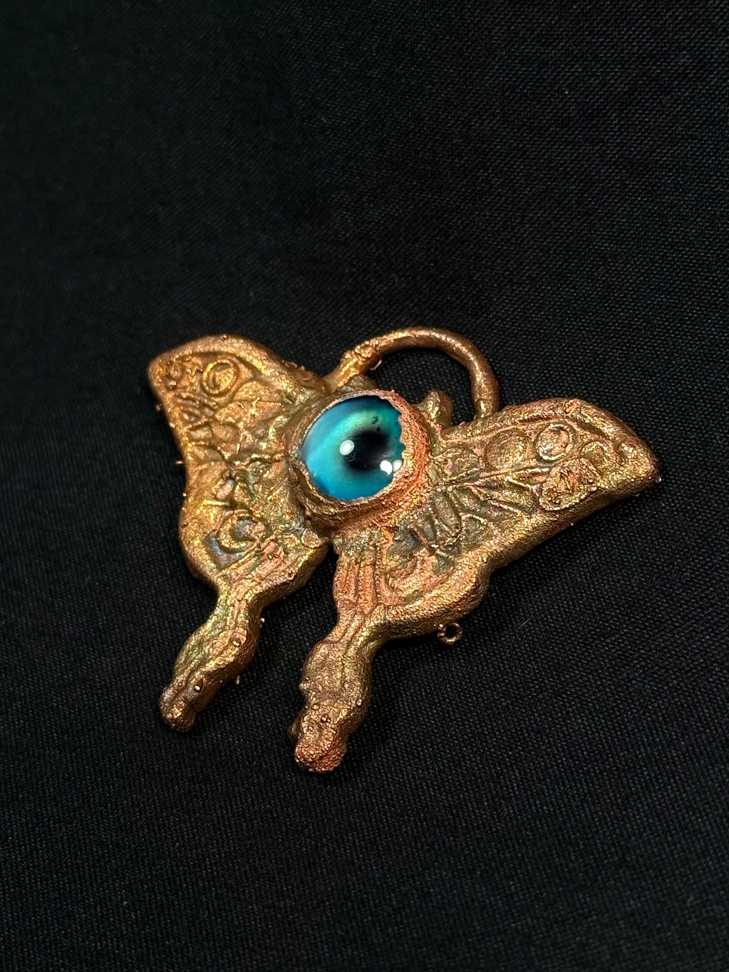 Eye butterfly amulet