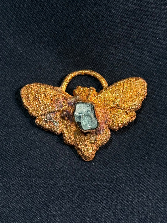 Garnet moth amulet