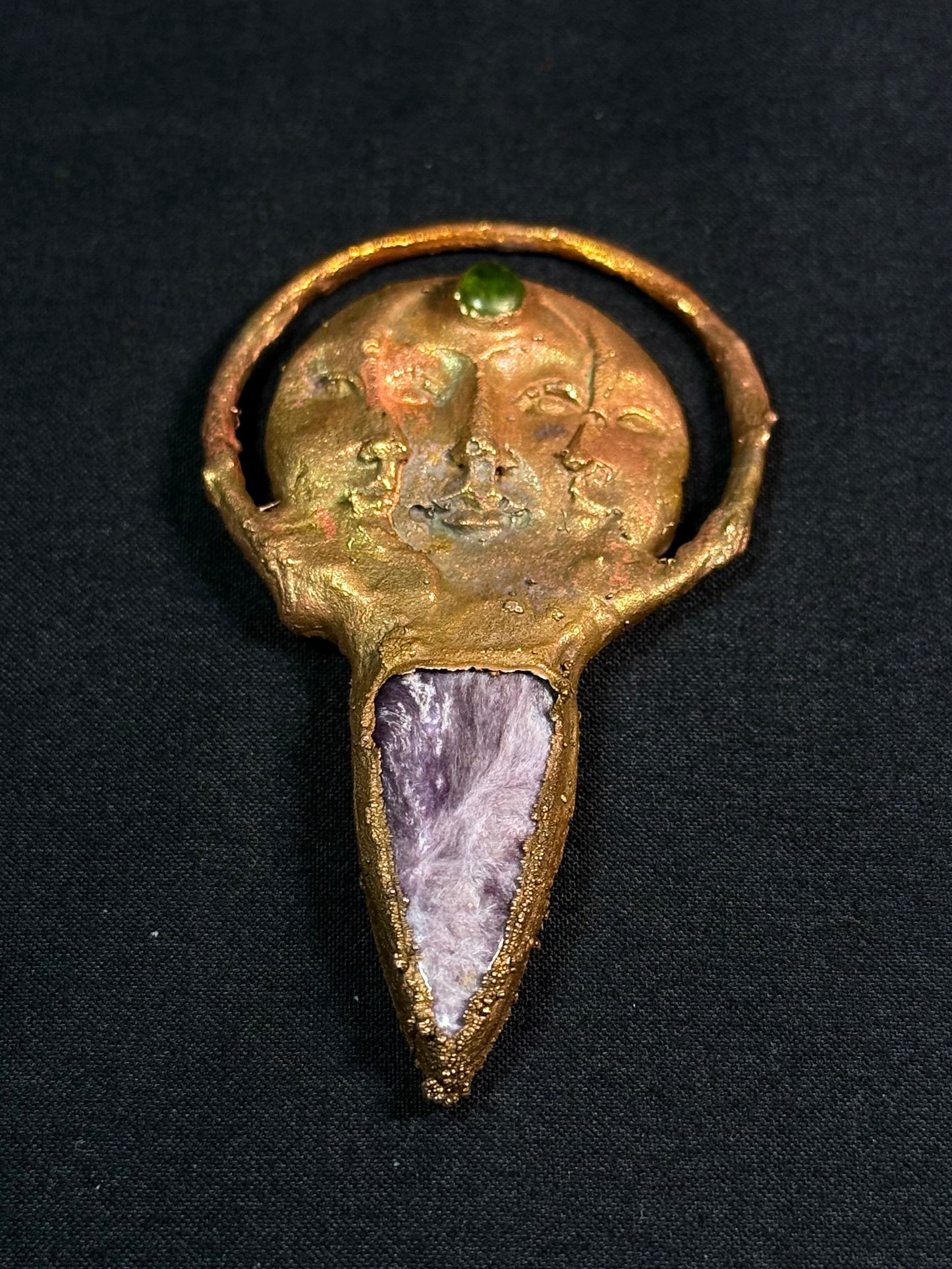 The sun and moon charoite amulet