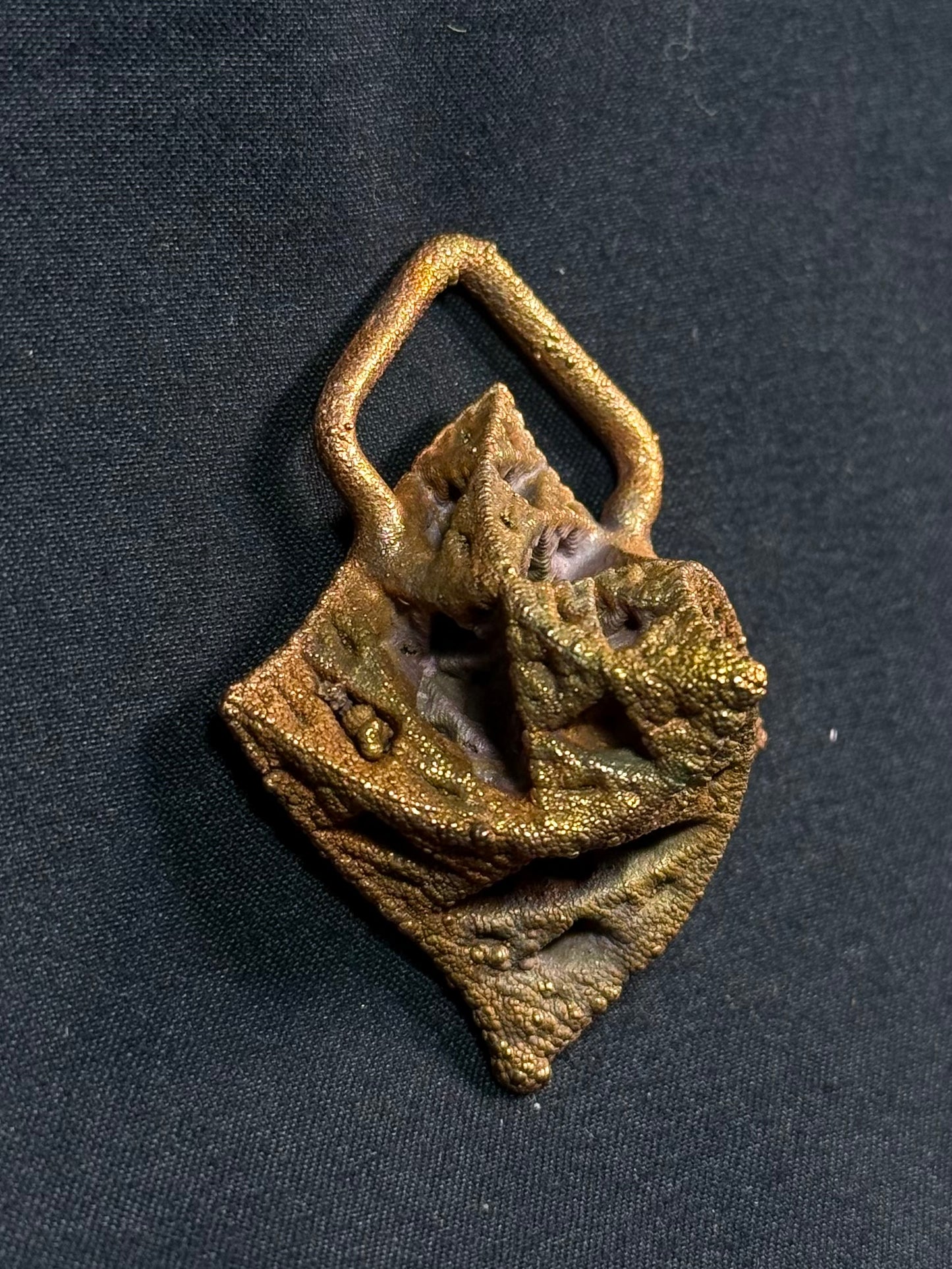 Warped pyramid amulet