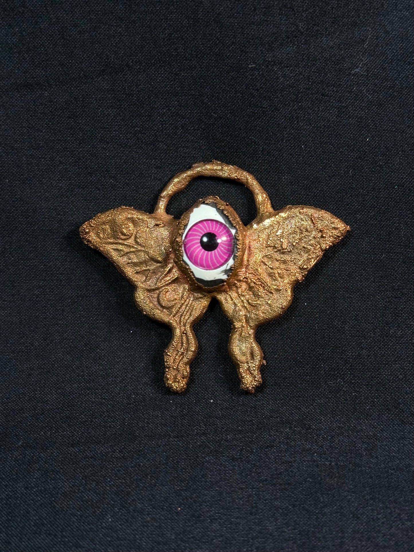 Eye butterfly amulet