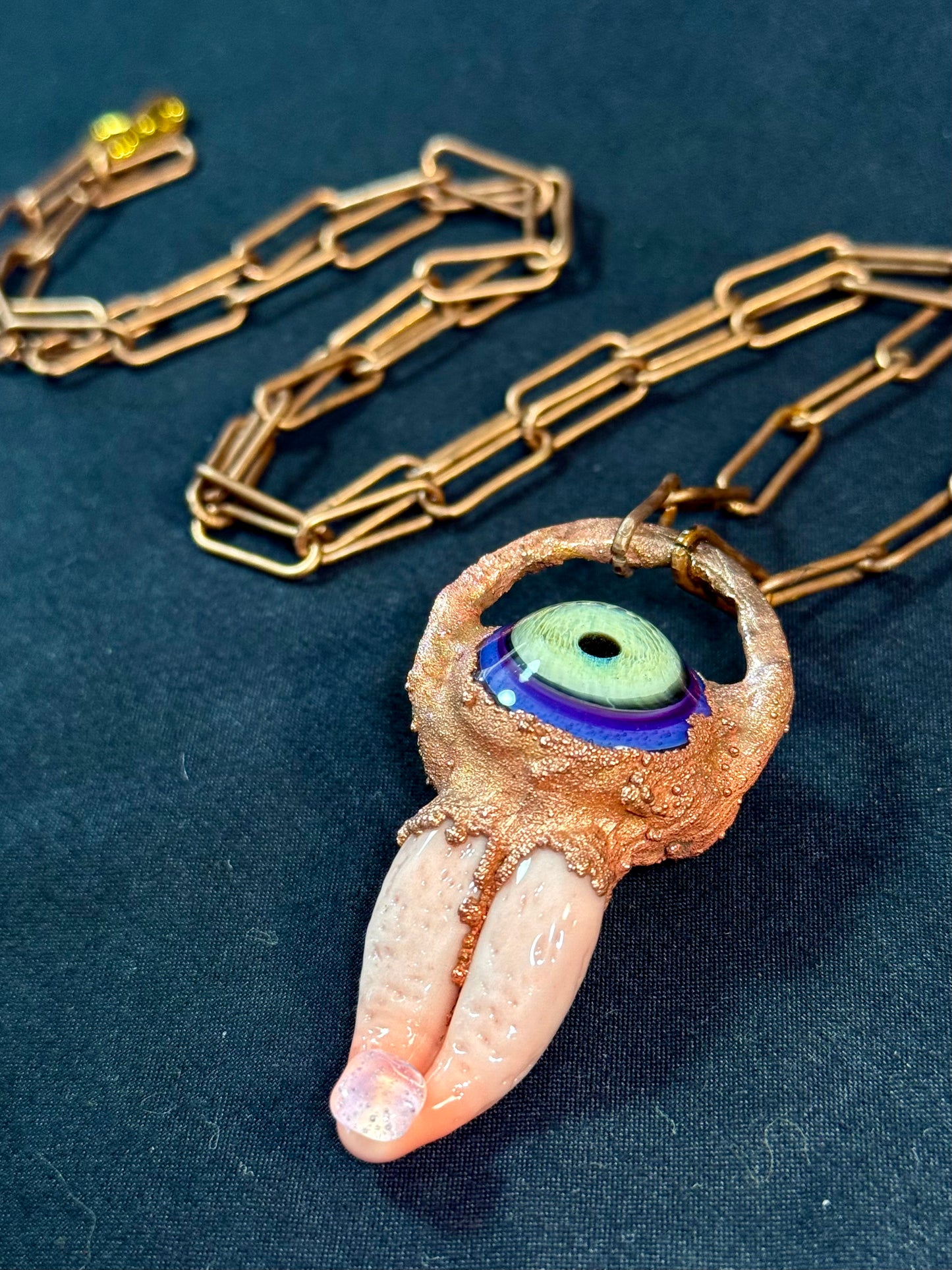 Glass tongue and eye amulet
