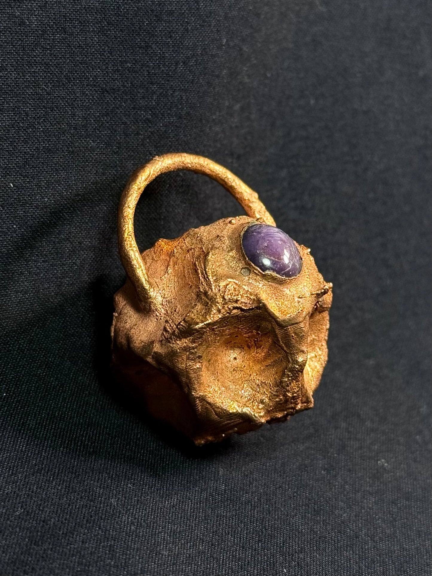 Tessellated rose star sapphire amulet