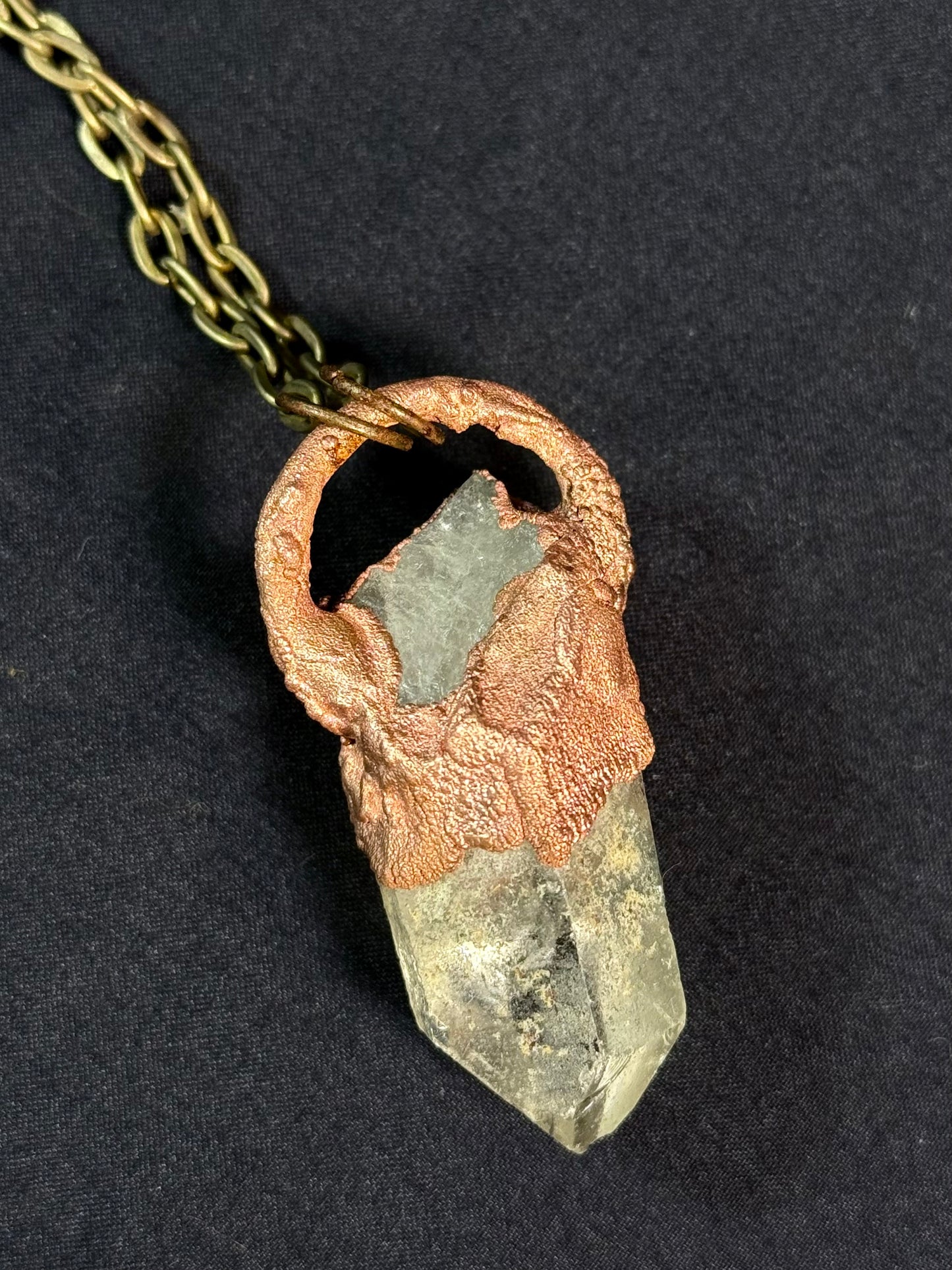 Quartz and charoite amulet