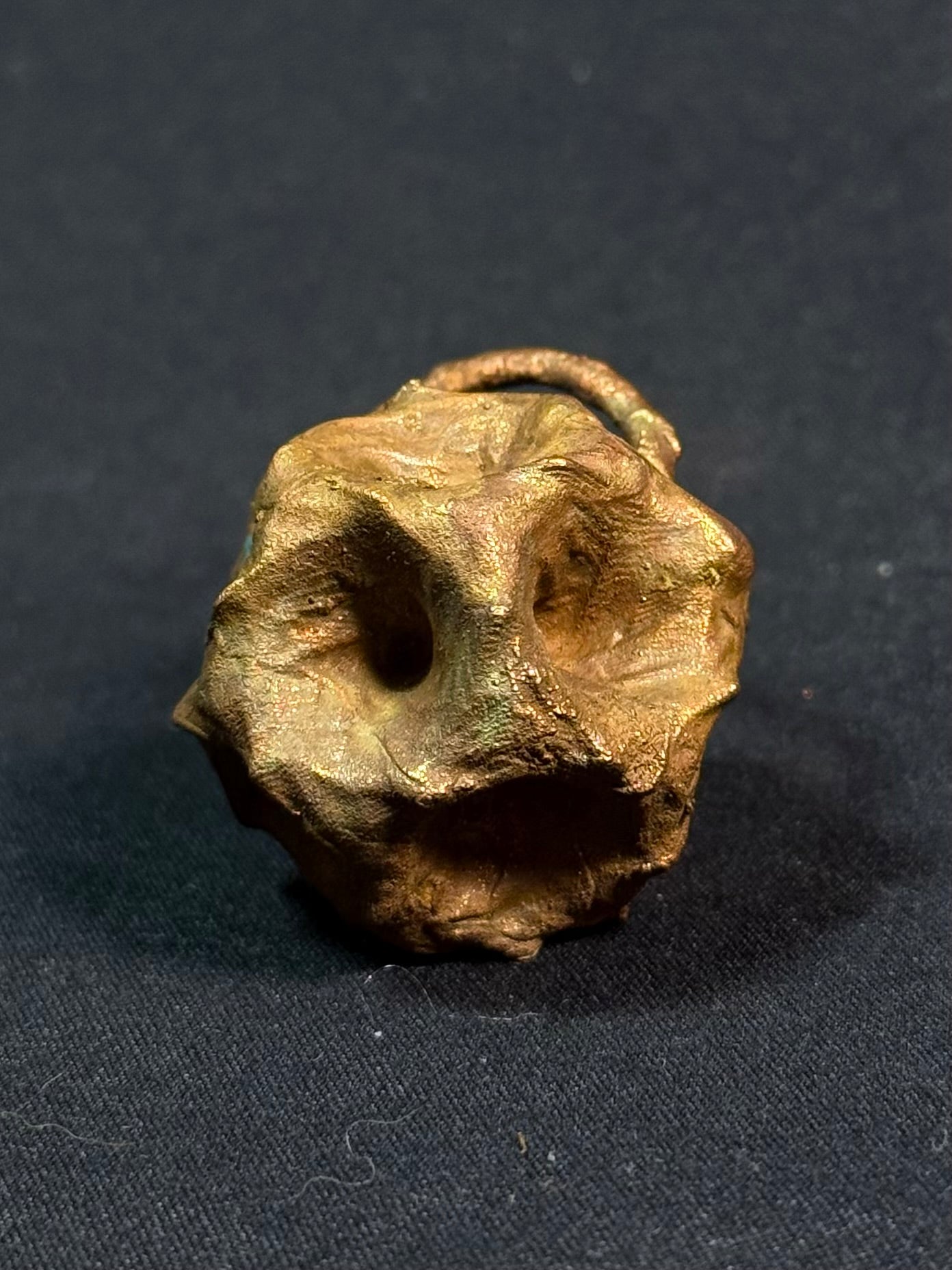 Tessellated rose quartz amulet