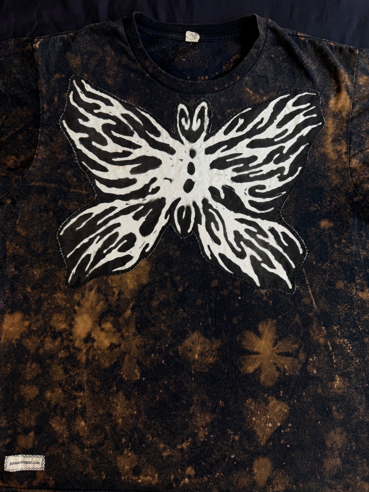 Abstract butterfly + shape bleach dyed t-shirt