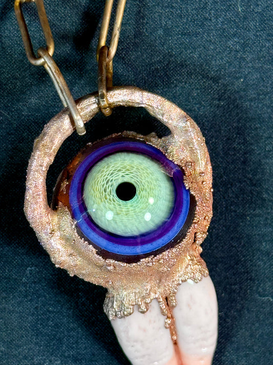 Glass tongue and eye amulet