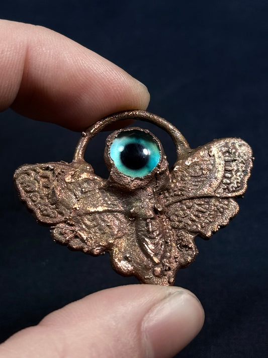 Eye moth amulet