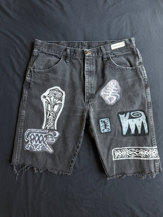 Black and white patch black jean shorts