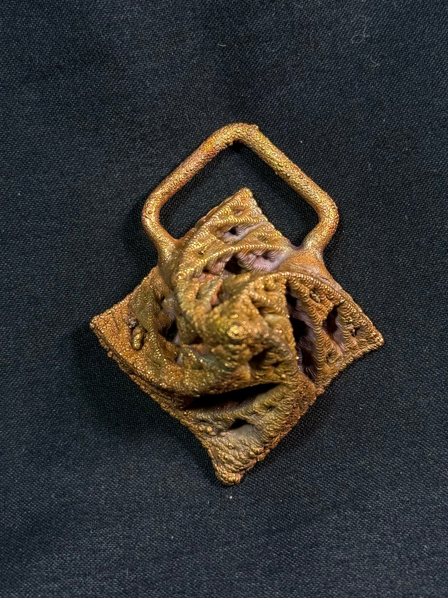 Warped pyramid amulet