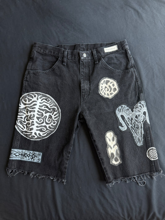 Black and white patch black jean shorts