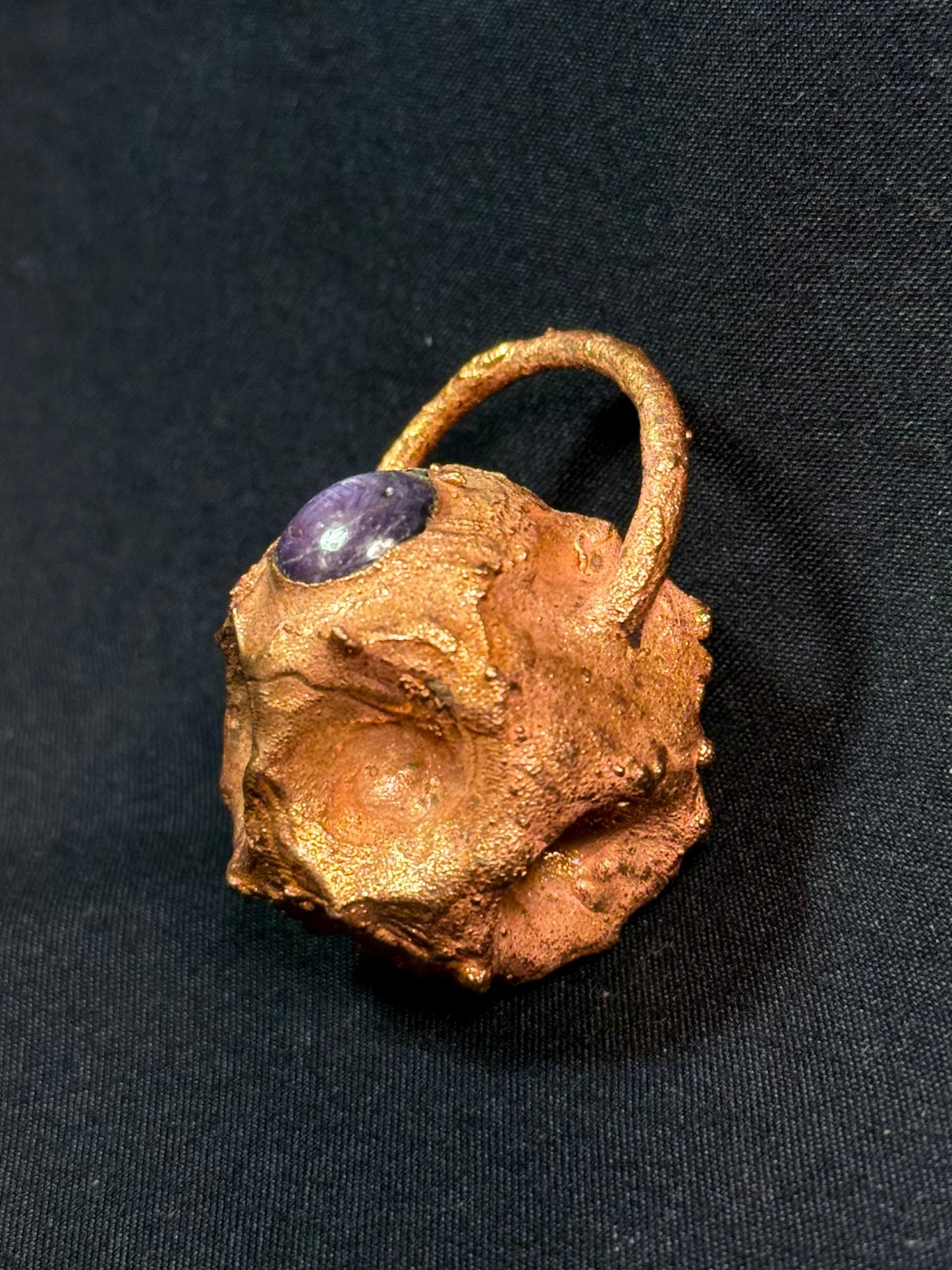 Tessellated rose star sapphire amulet