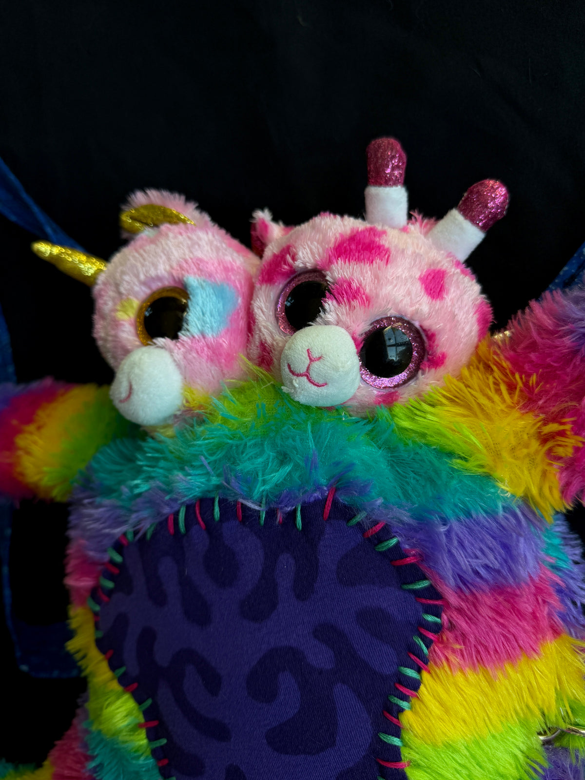 Two headed rainbow explosion hybrid back pack