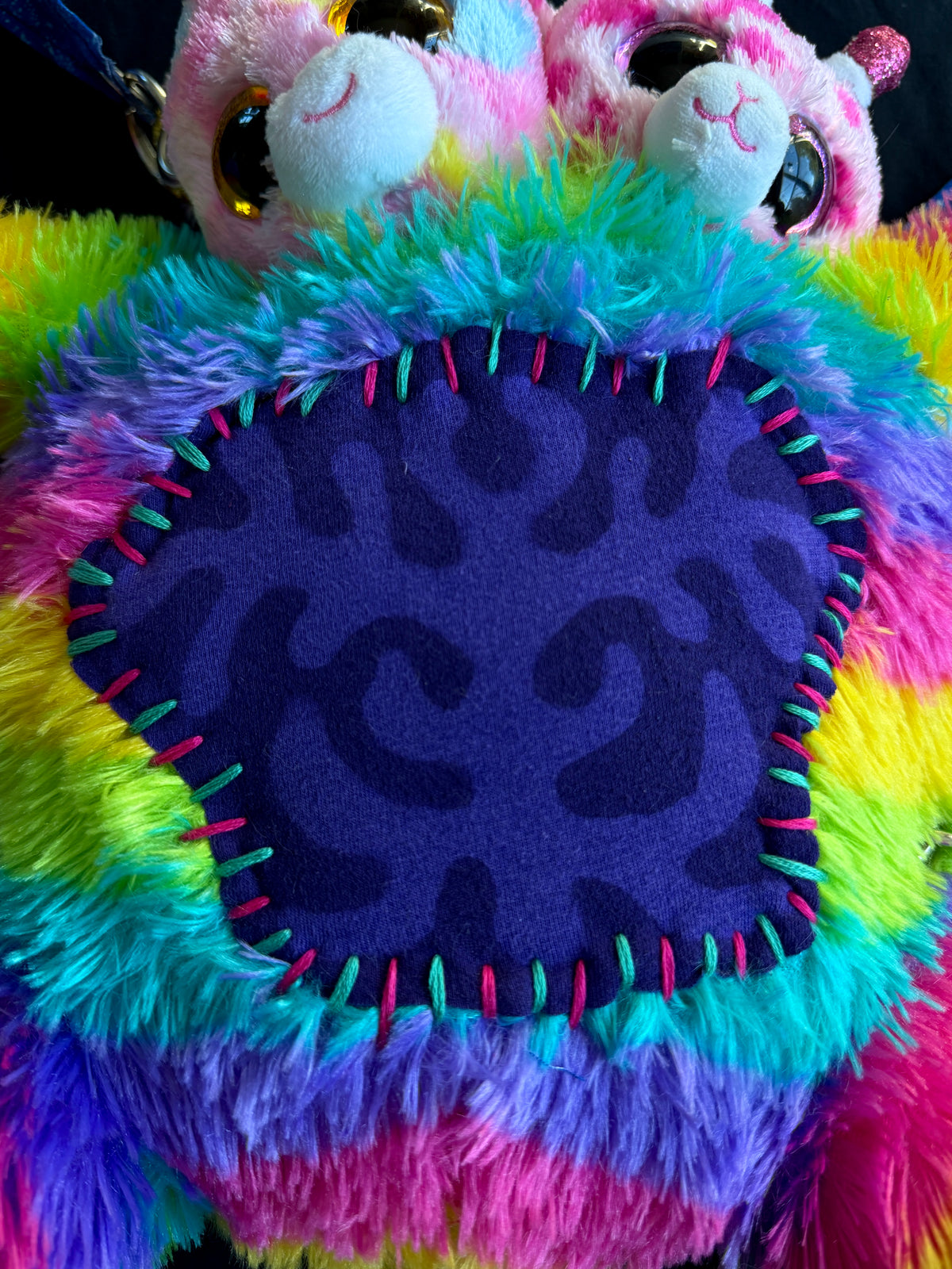 Two headed rainbow explosion hybrid back pack