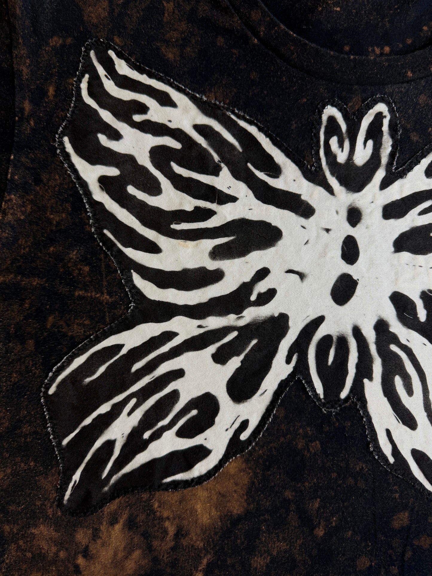 Abstract butterfly + shape bleach dyed t-shirt