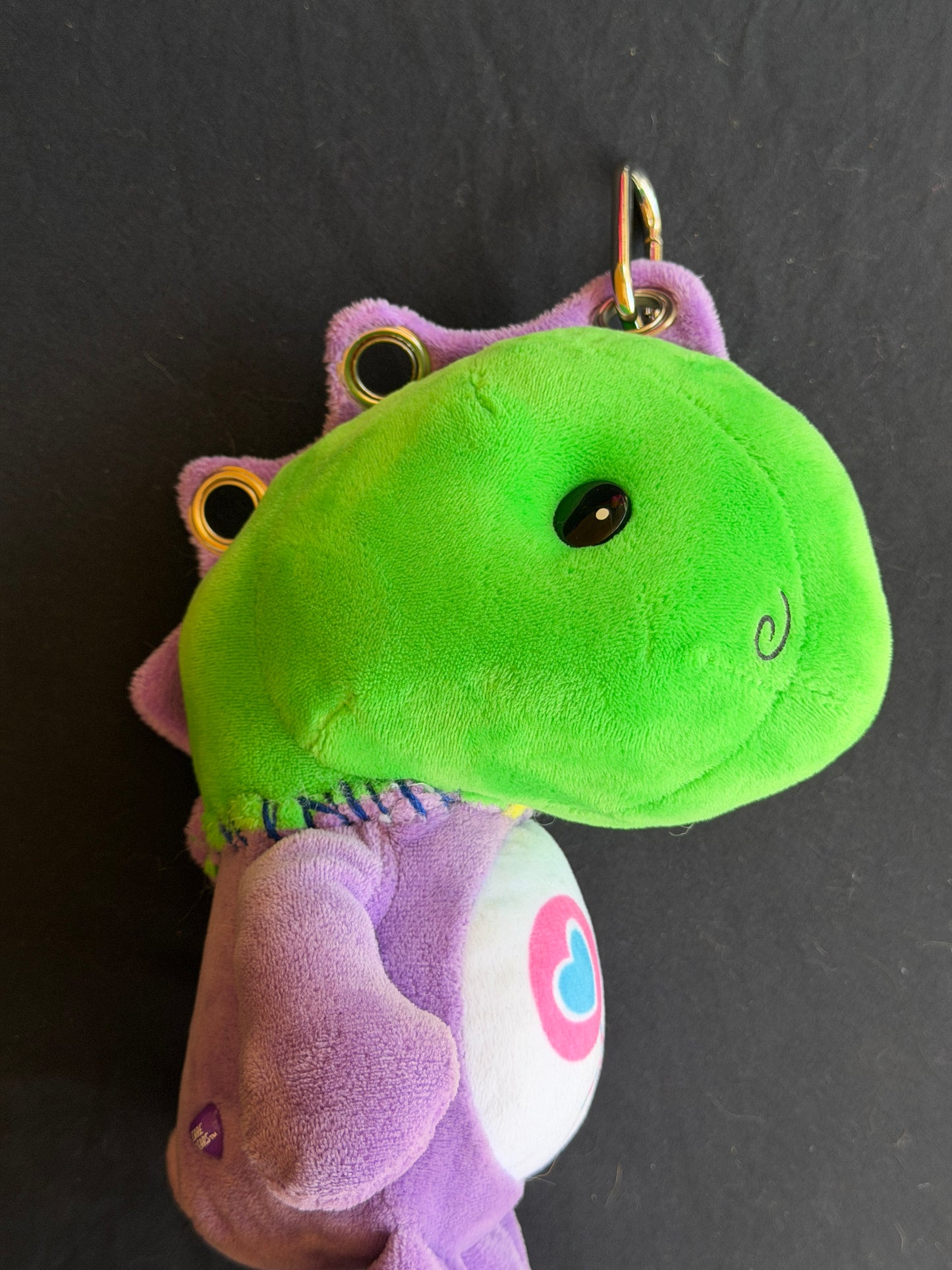 Dinosaur + purple care bear keychain buddy