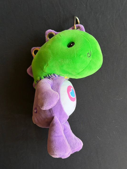 Dinosaur + purple care bear keychain buddy