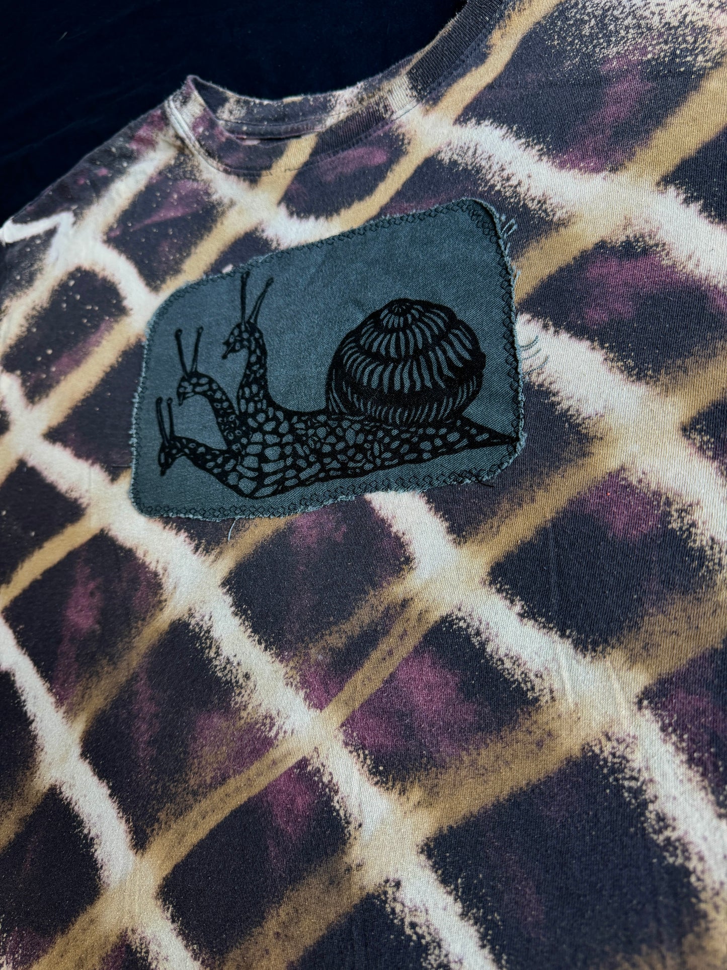 Three headed snail bleach dyed t-shirt