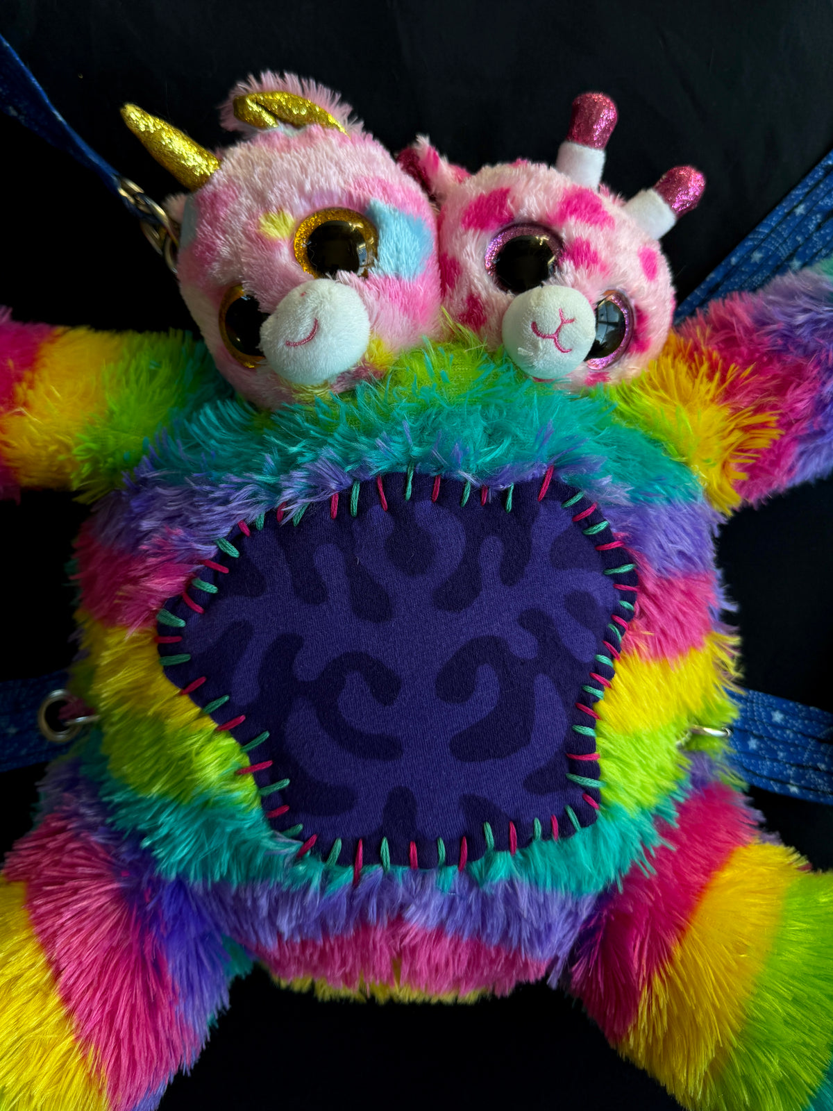 Two headed rainbow explosion hybrid back pack