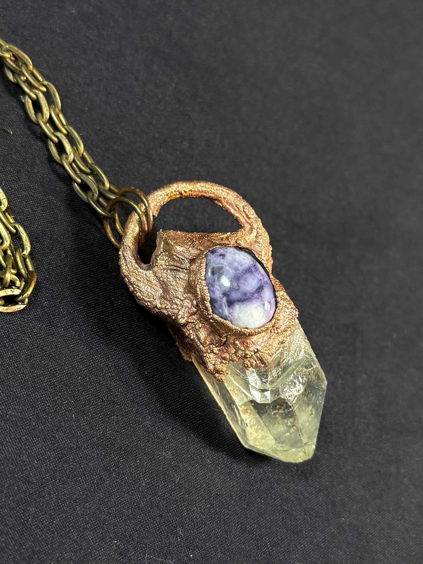 Quartz and charoite amulet