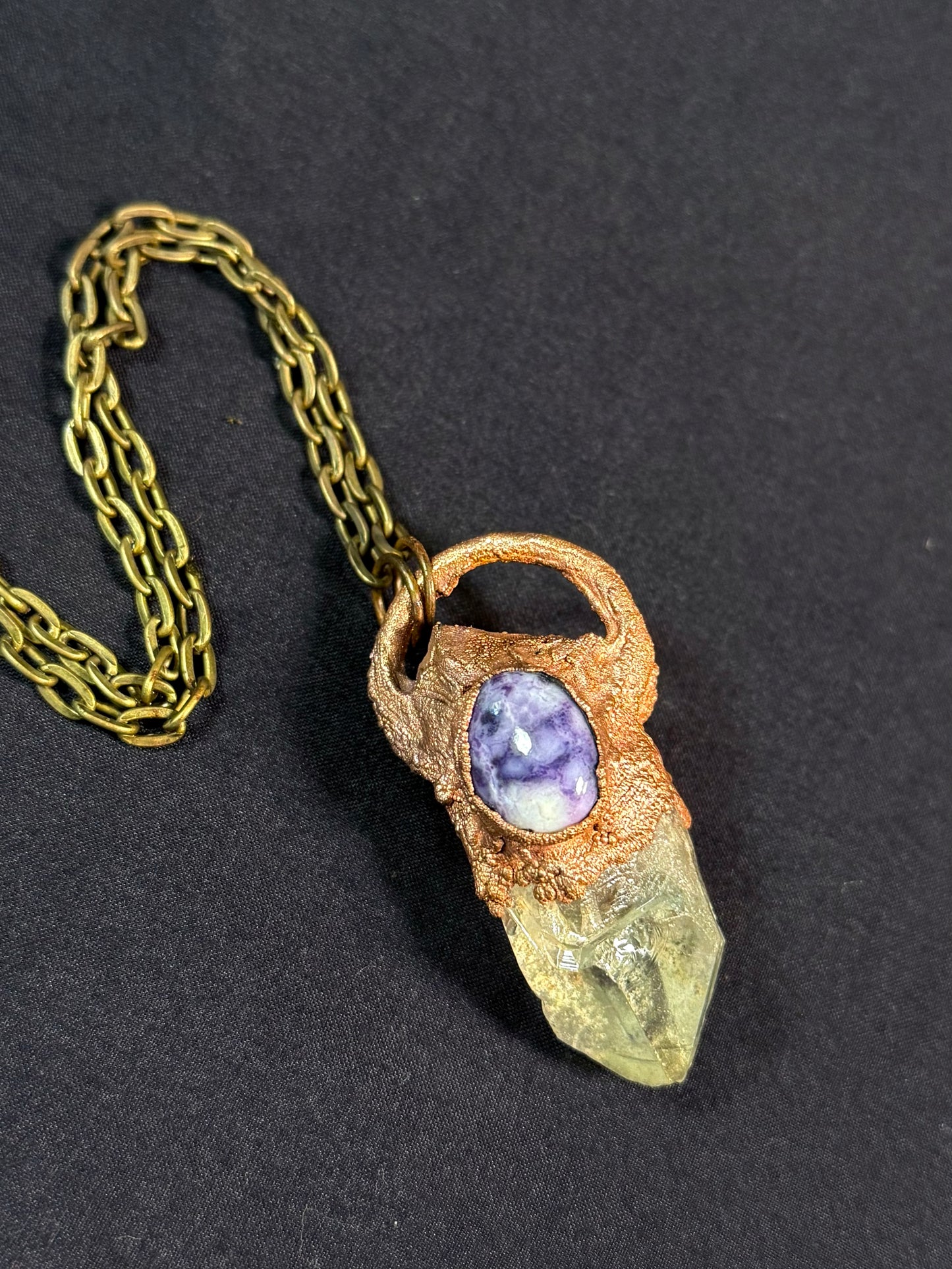 Quartz and charoite amulet