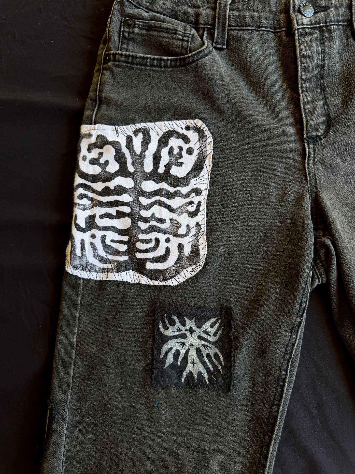 Black and white patch black jean shorts