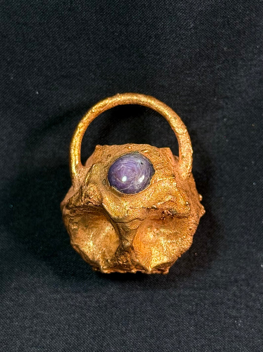 Tessellated rose star sapphire amulet