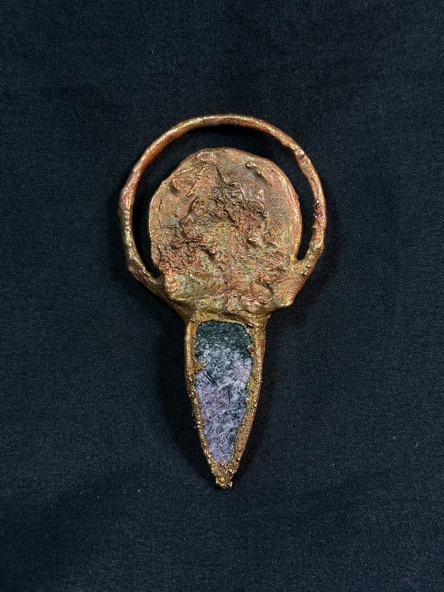 The sun and moon charoite amulet