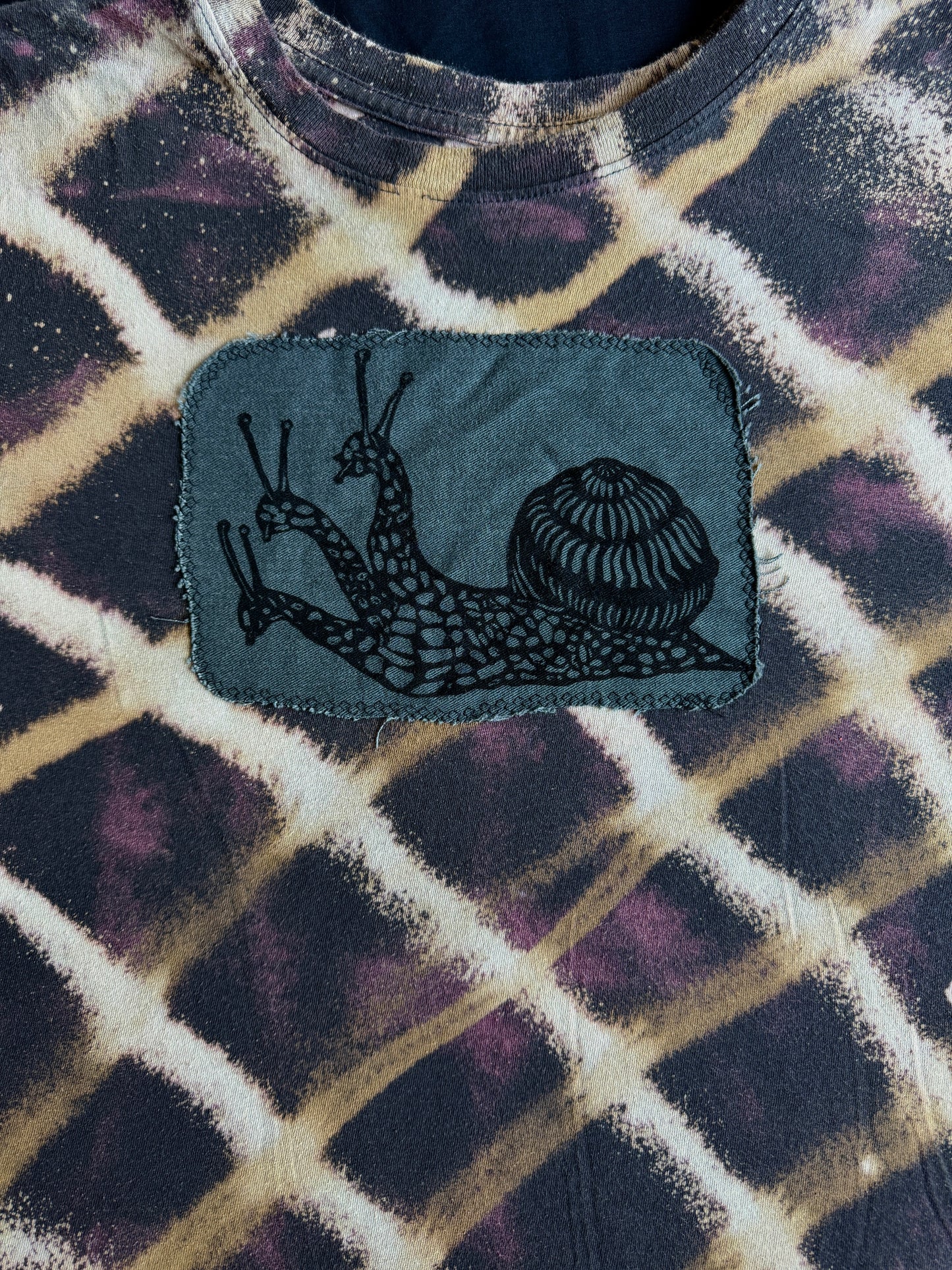 Three headed snail bleach dyed t-shirt