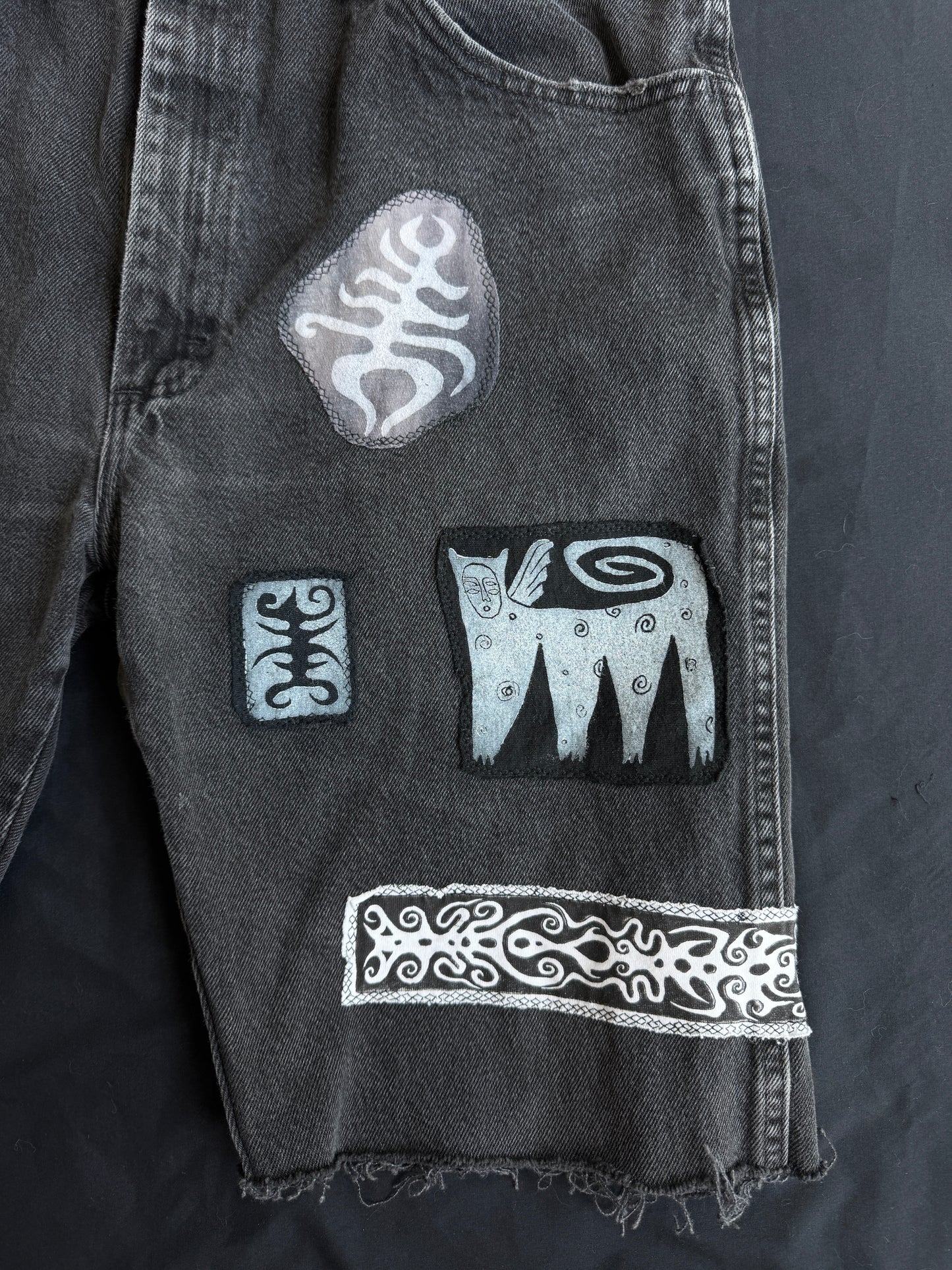 Black and white patch black jean shorts