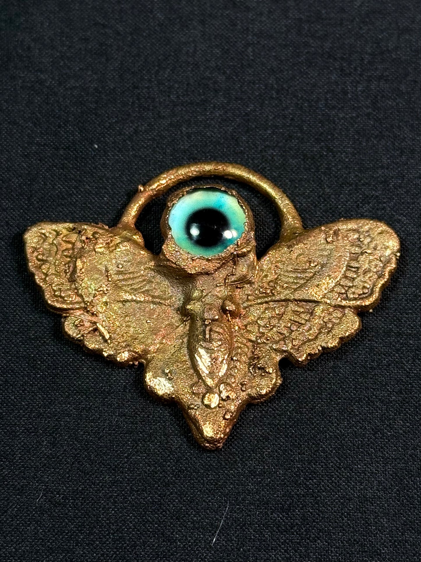 Eye moth amulet