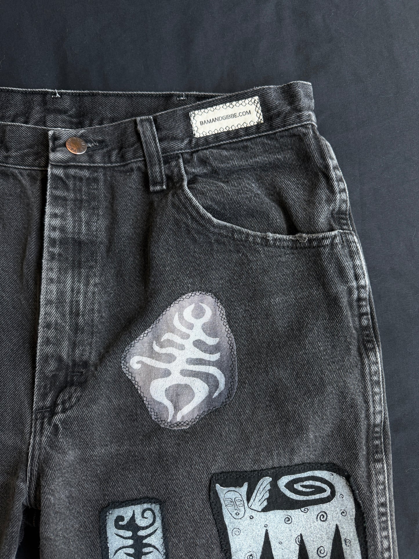 Black and white patch black jean shorts