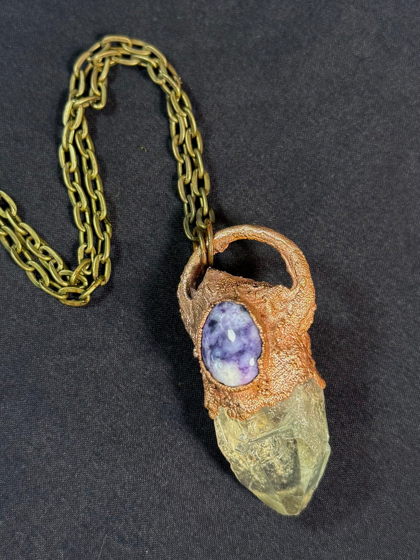 Quartz and charoite amulet