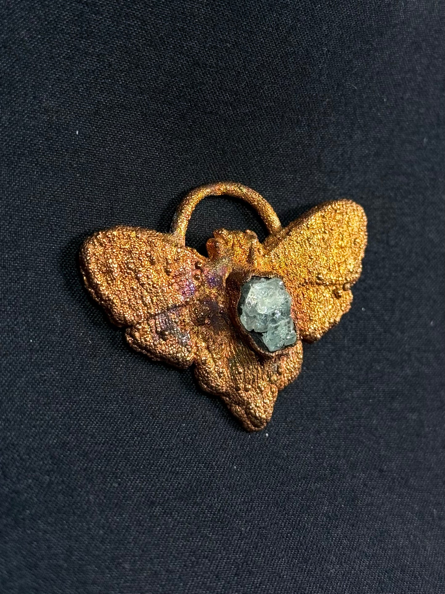 Garnet moth amulet
