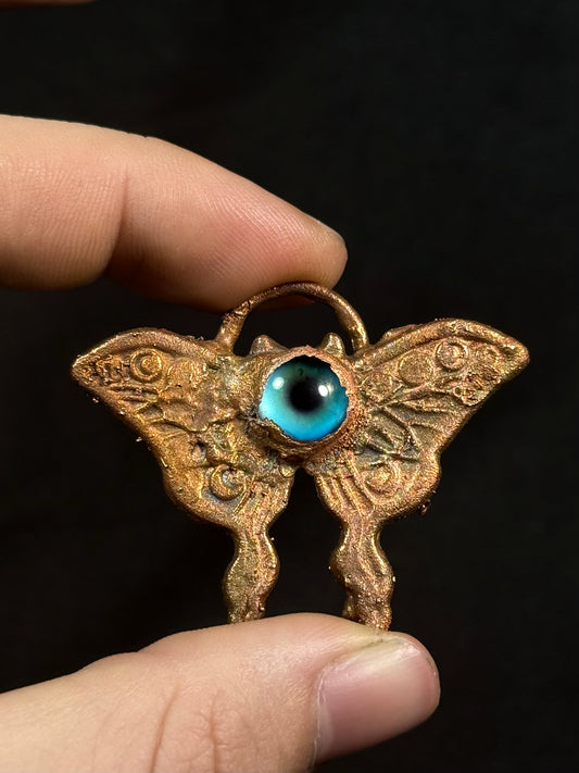 Eye butterfly amulet