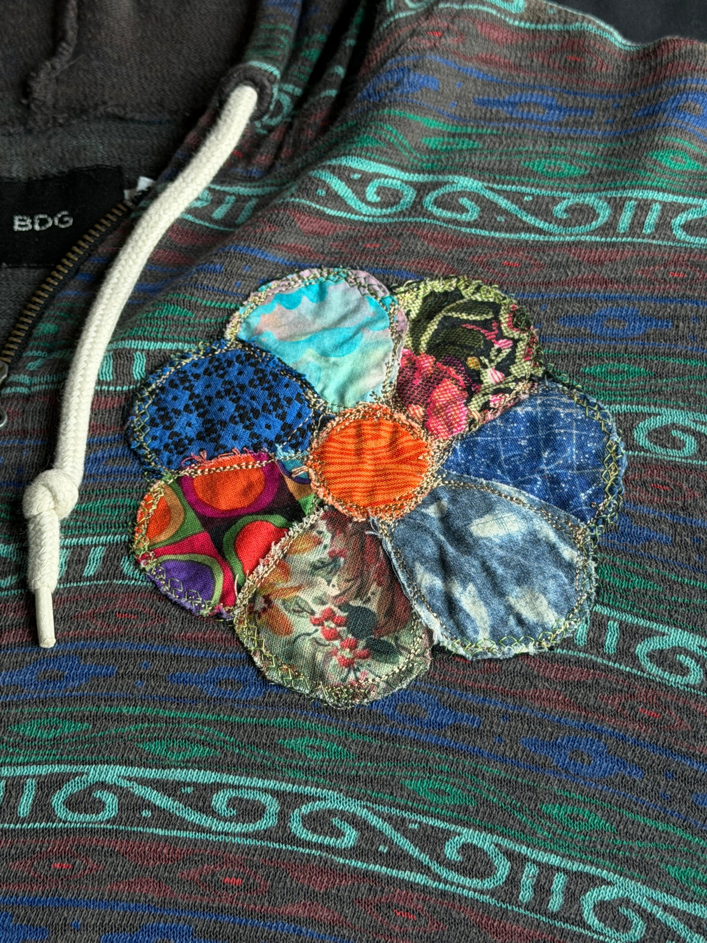 Scrappy clown flower zip up