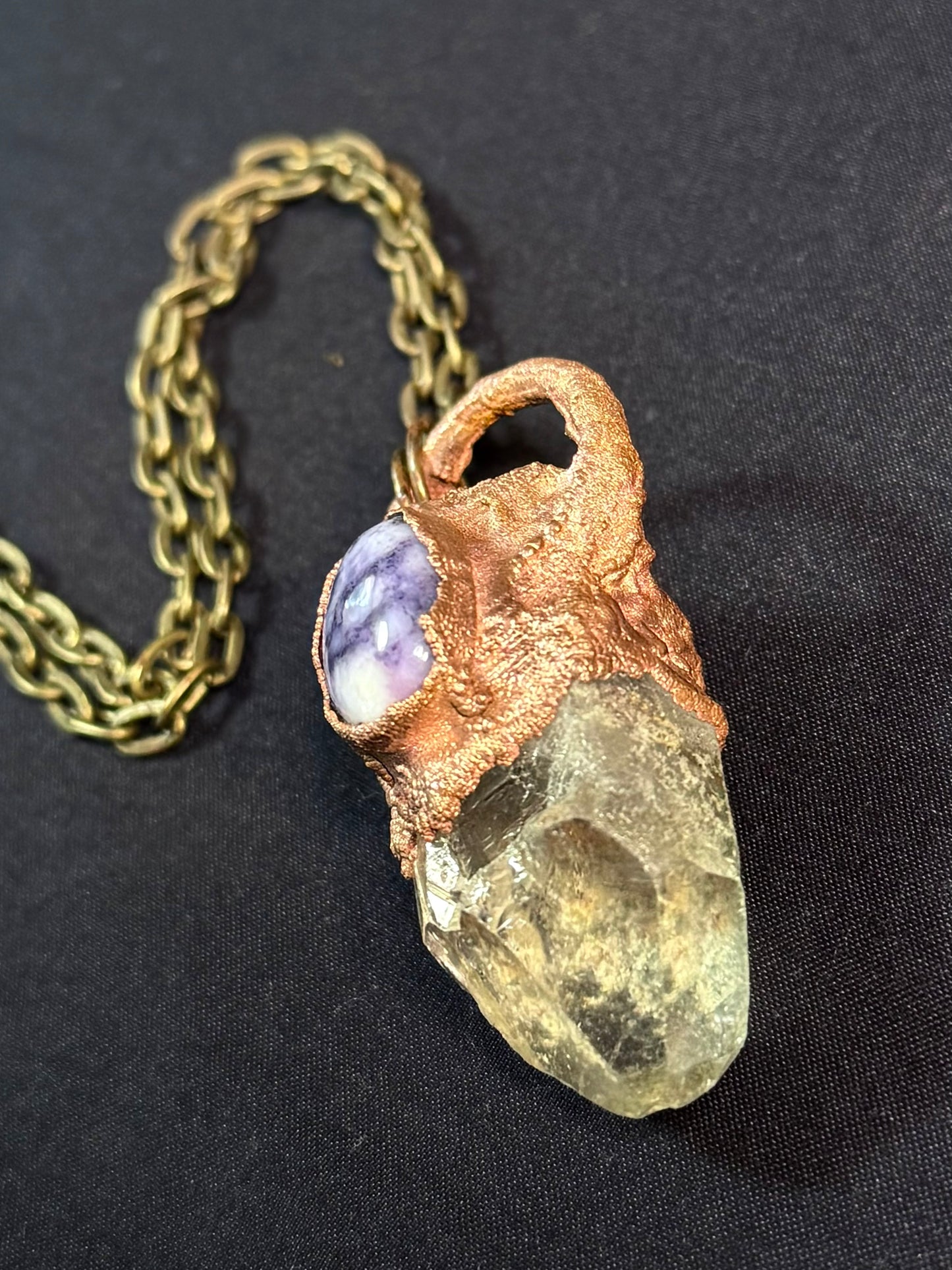 Quartz and charoite amulet