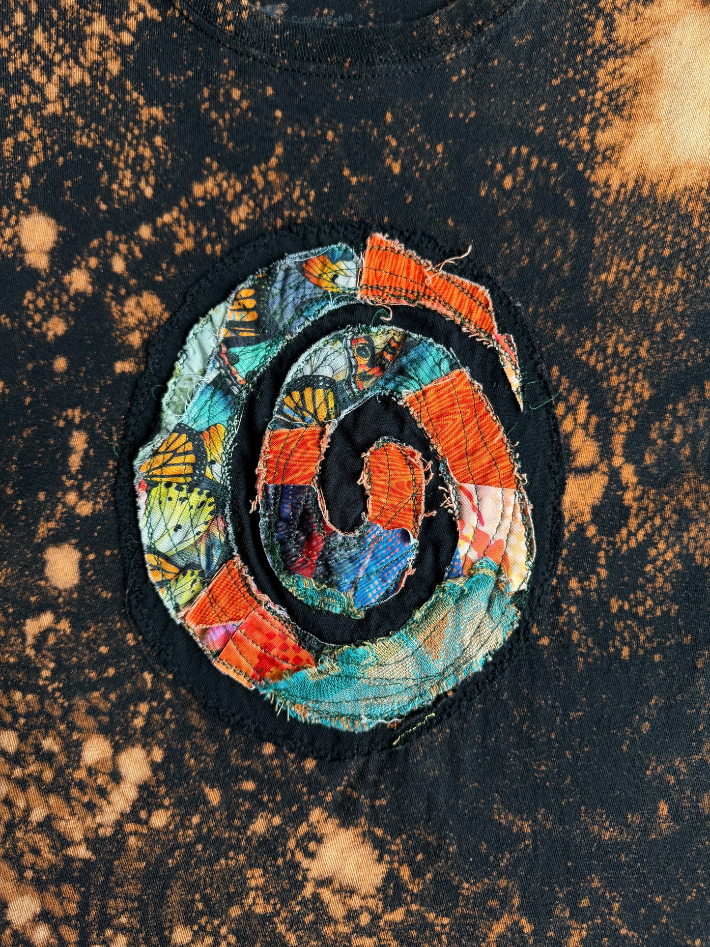 Spiral patch bleach dyed t-shirt