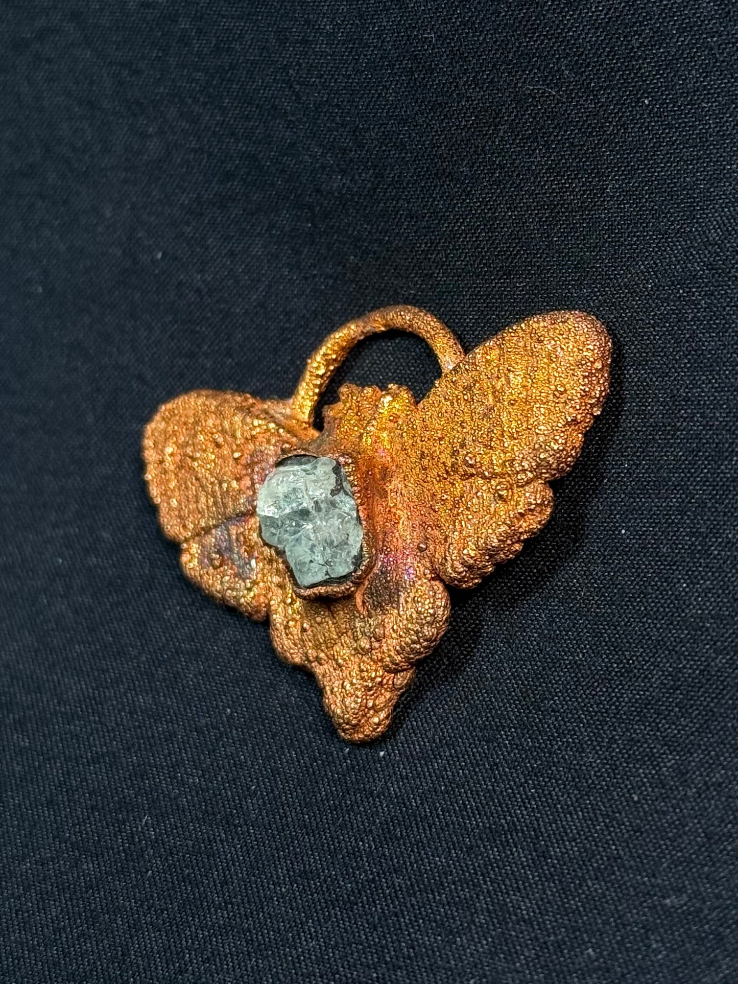 Garnet moth amulet