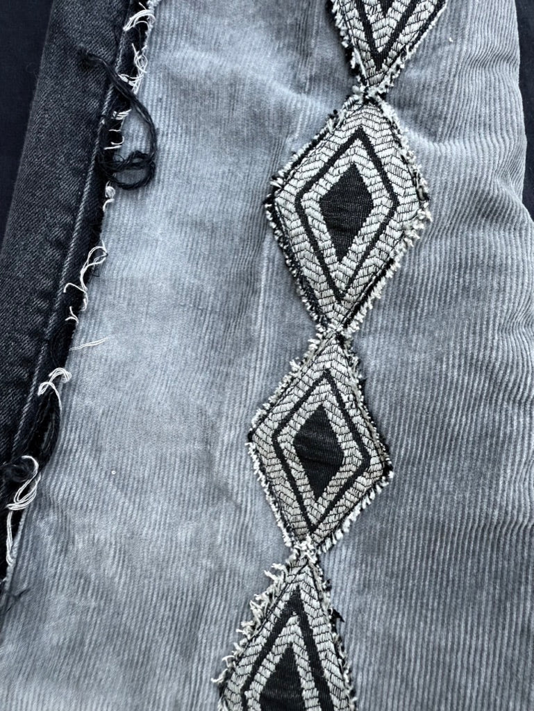 Black and white geometric denim pants with corduroy flair