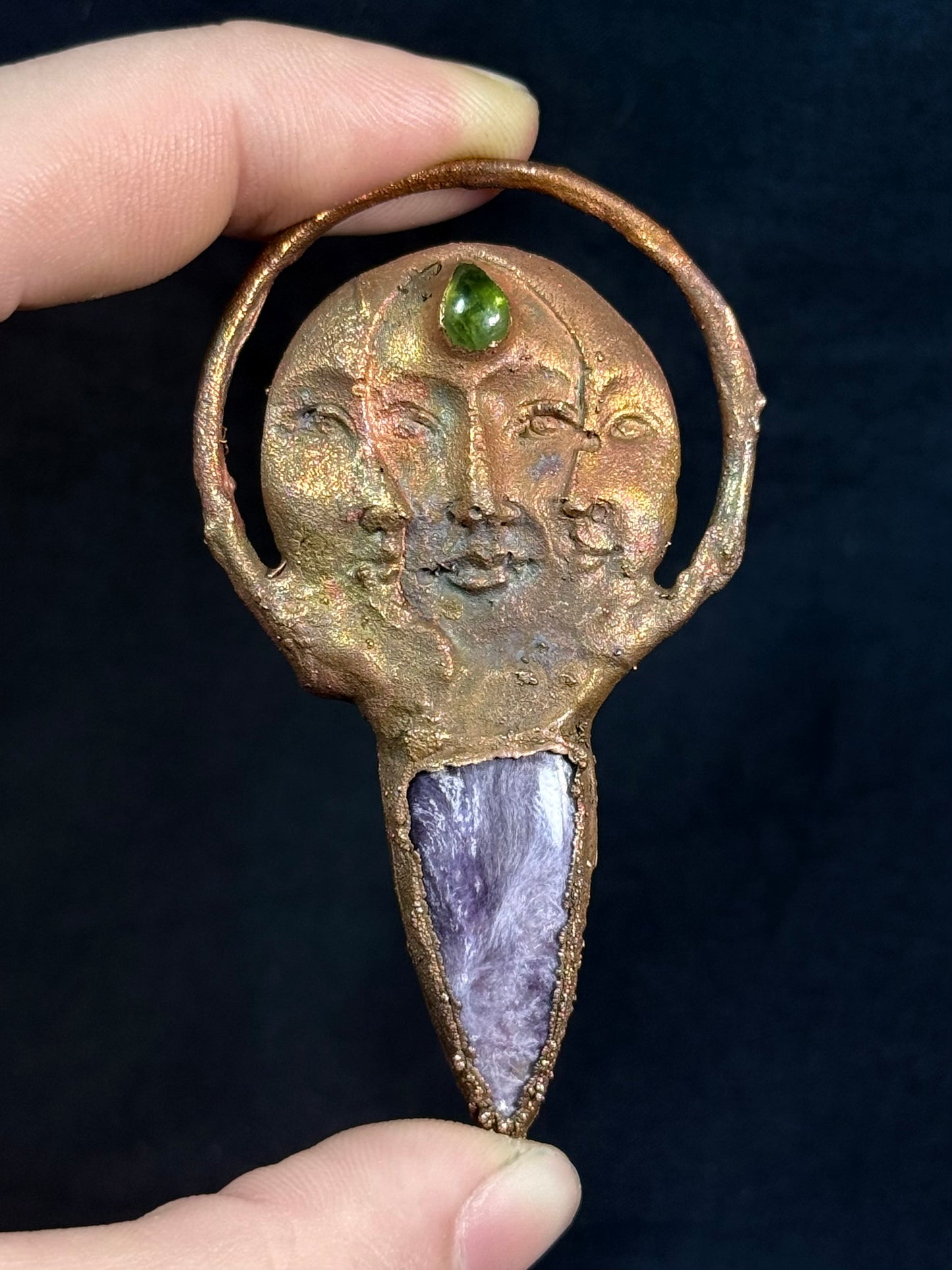 The sun and moon charoite amulet