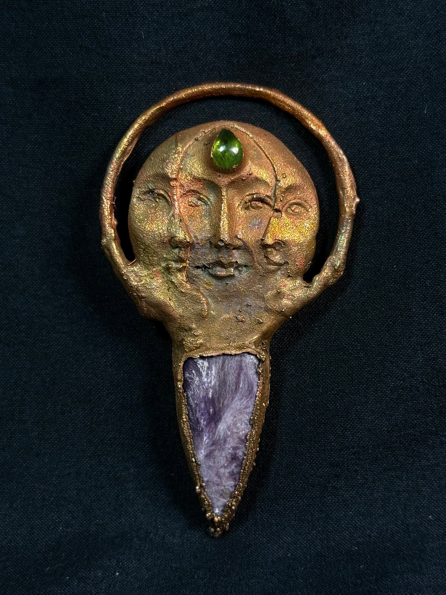 The sun and moon charoite amulet