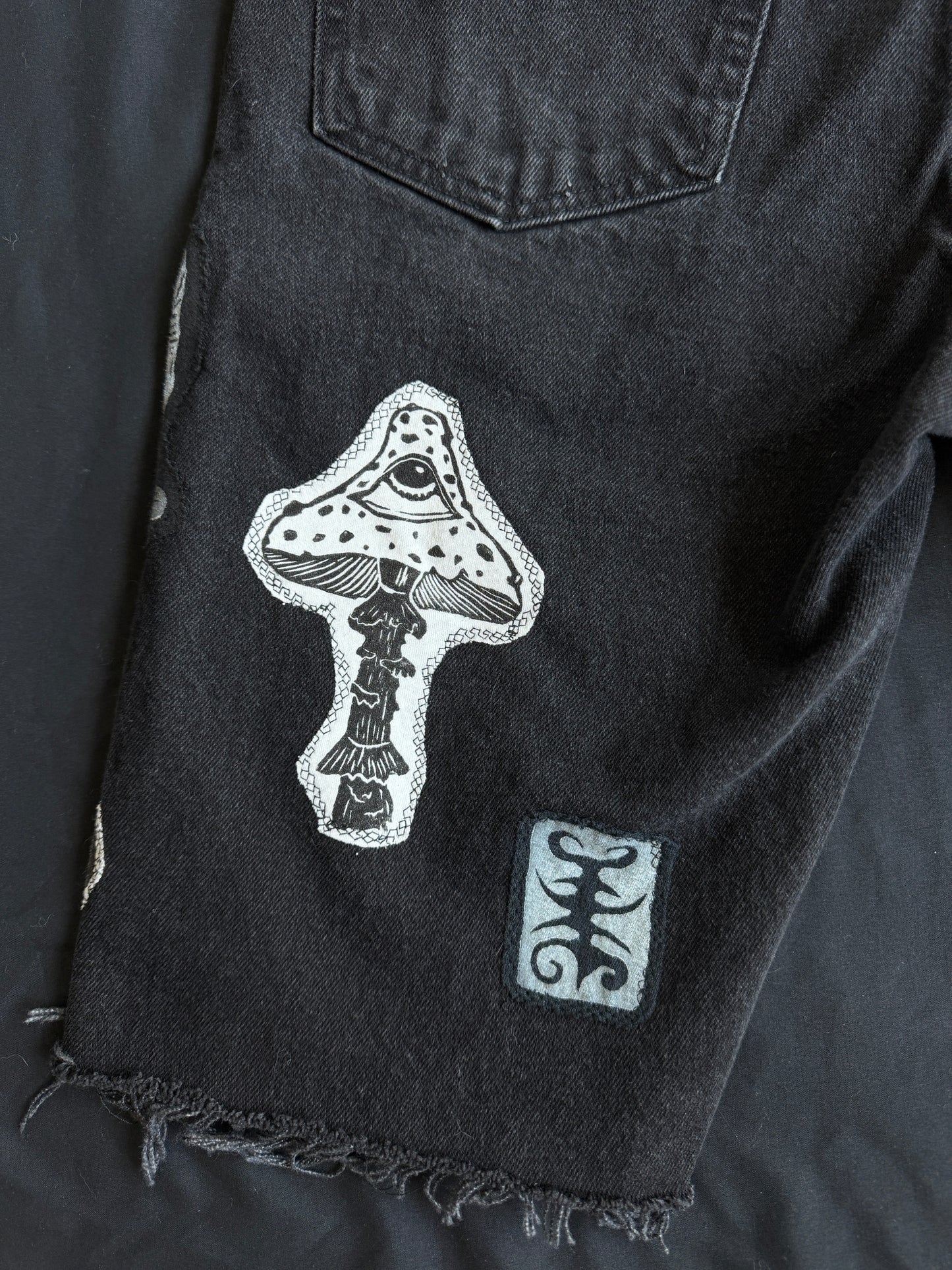 Black and white patch black jean shorts